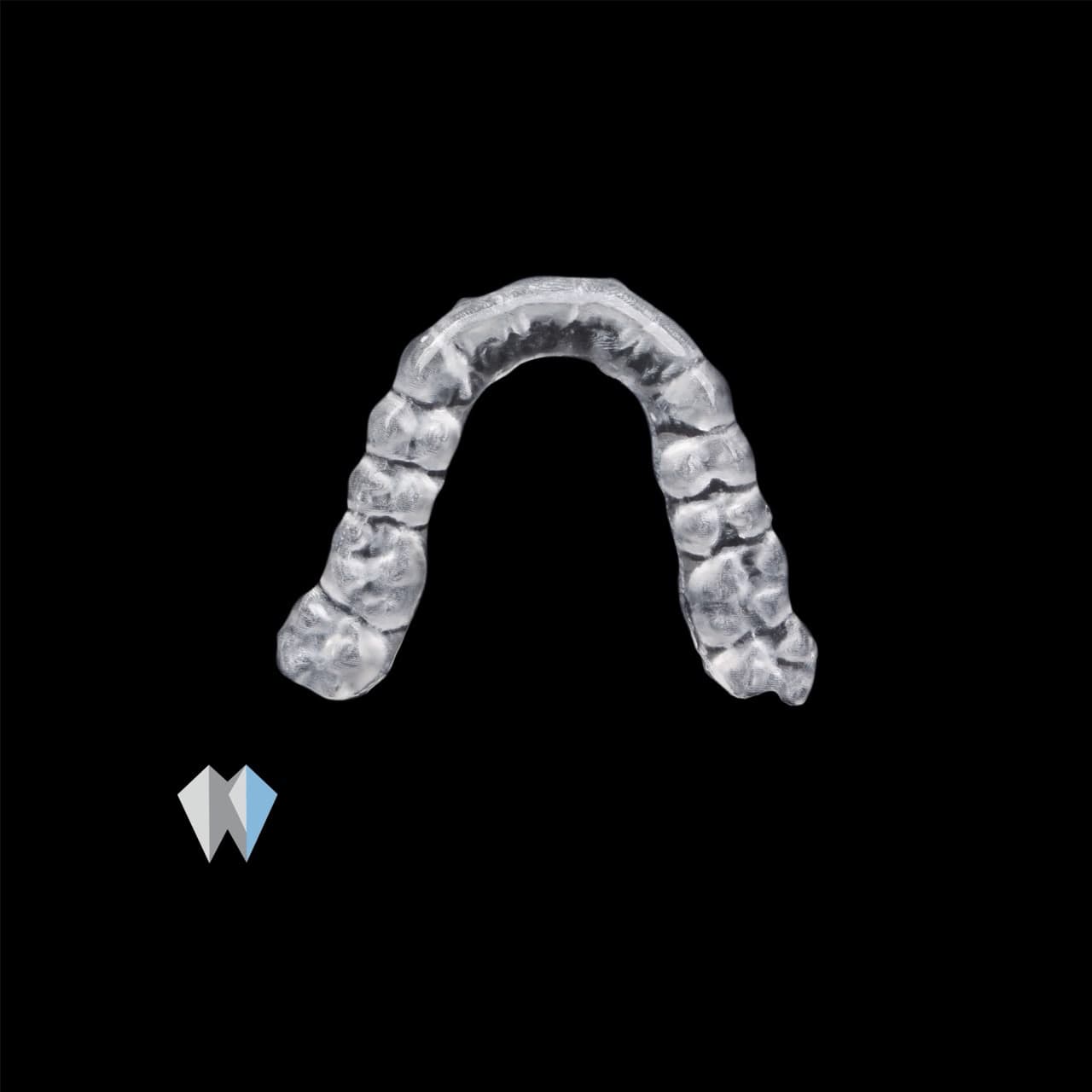 Transparent plastic dental aligner tray for teeth straightening, centered on a solid black background.